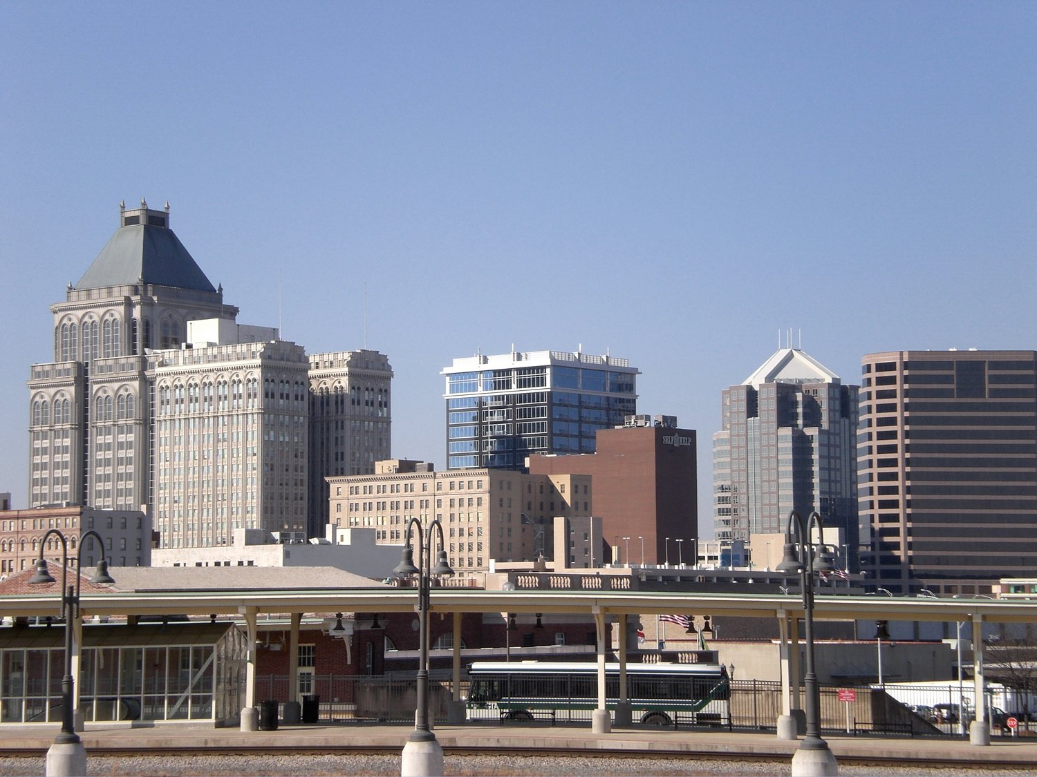Panoramic view of the Greensboro, NC city skyline featuring the Lincoln Financial building, representing the primary service area for Smithrock Roofing