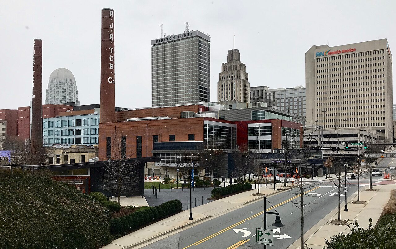 Winston-Salem, NC city skyline featuring the Wells Fargo Center and Reynolds Building, representing the primary service area for Smithrock Roofing