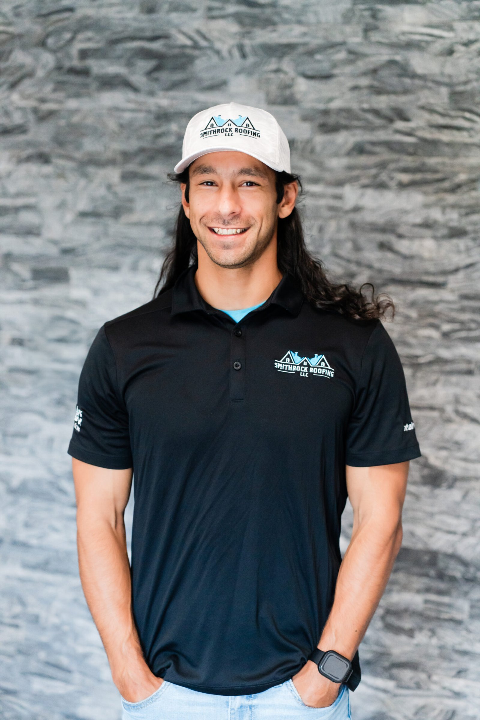 Caleb Taylor, VP of Operations at Smithrock Roofing, wearing company gear