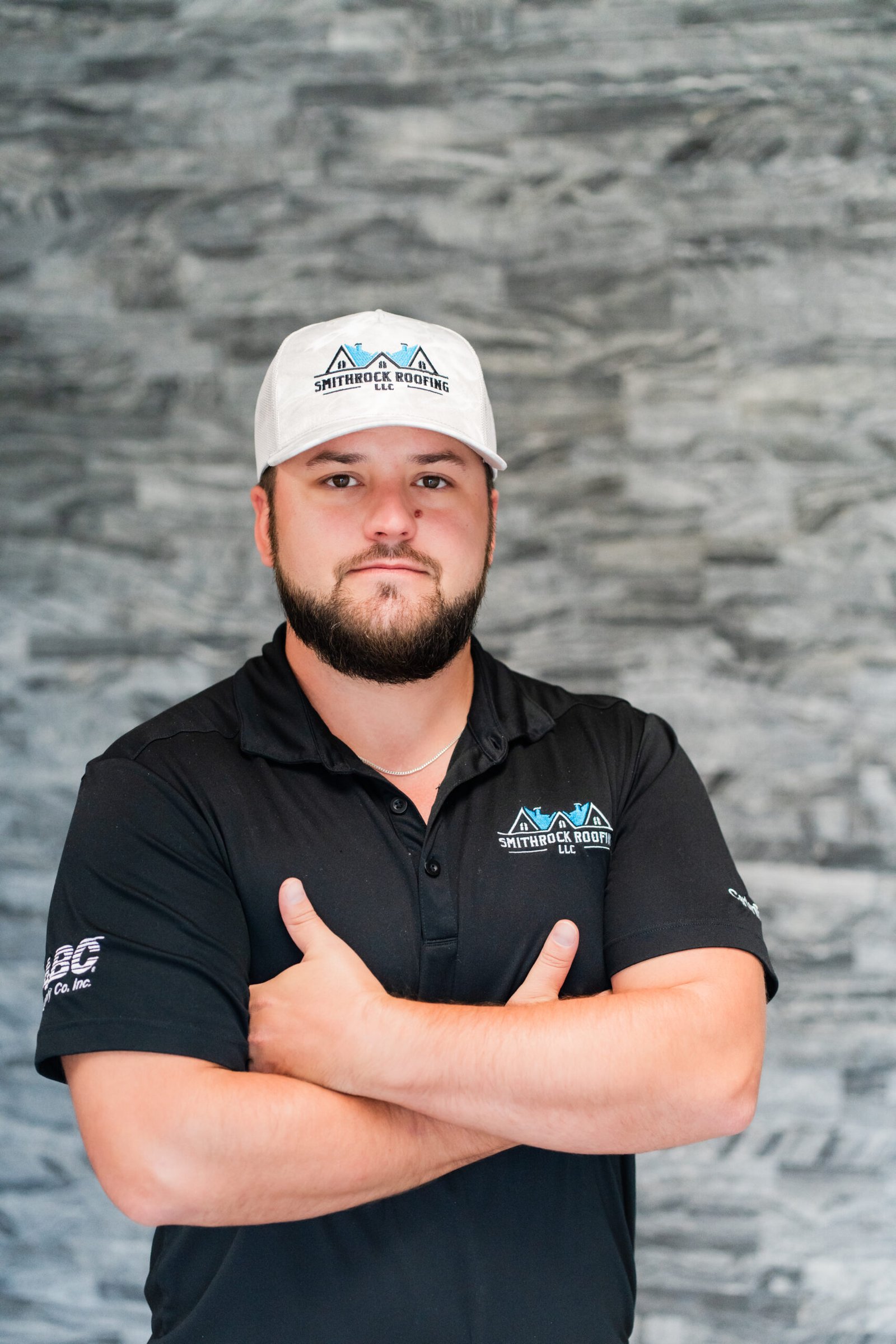 Jordan Smith, owner at Smithrock Roofing, wearing company gear